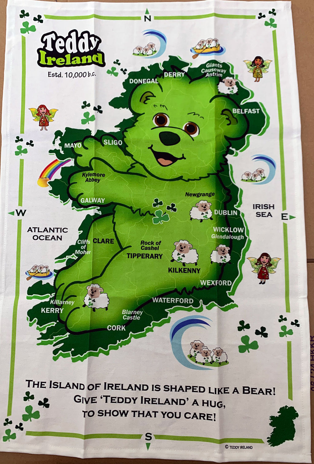 Tea towel with a map of Ireland shaped like a bear, featuring Teddy Ireland branding.