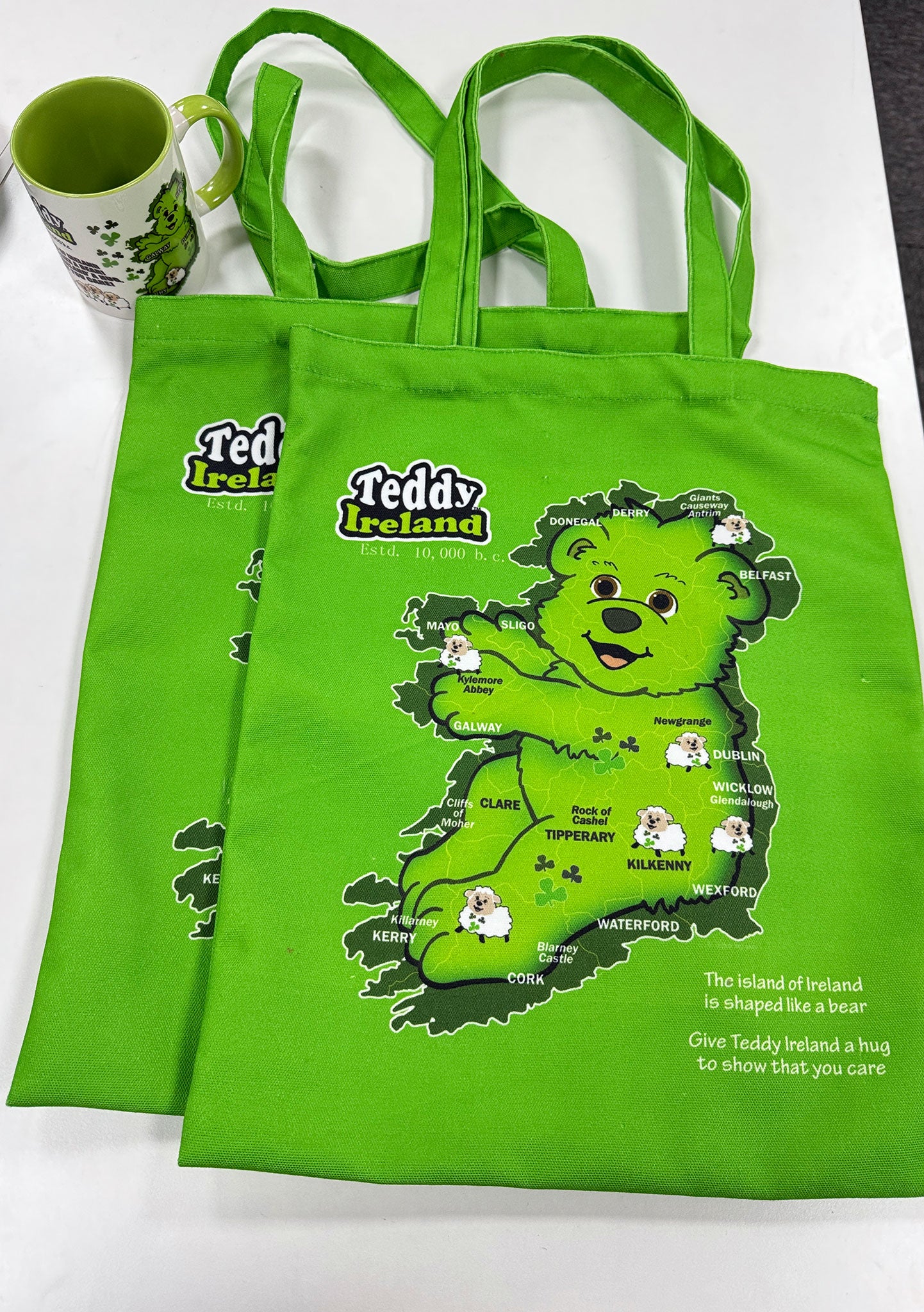 Green tote bag with Teddy Ireland design on a white background